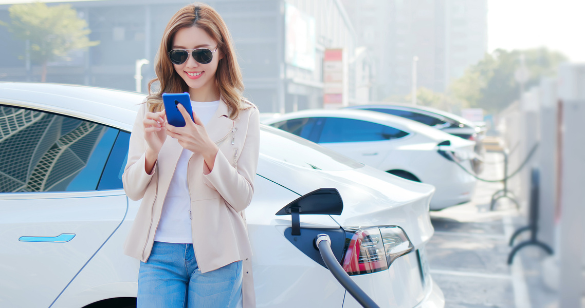 Woman Charging Electric Car