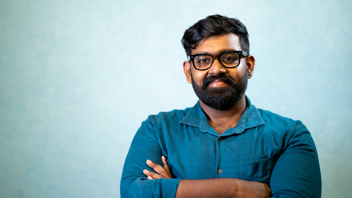 Man in Blue Long Sleeves Shirt with his Hands Crossed